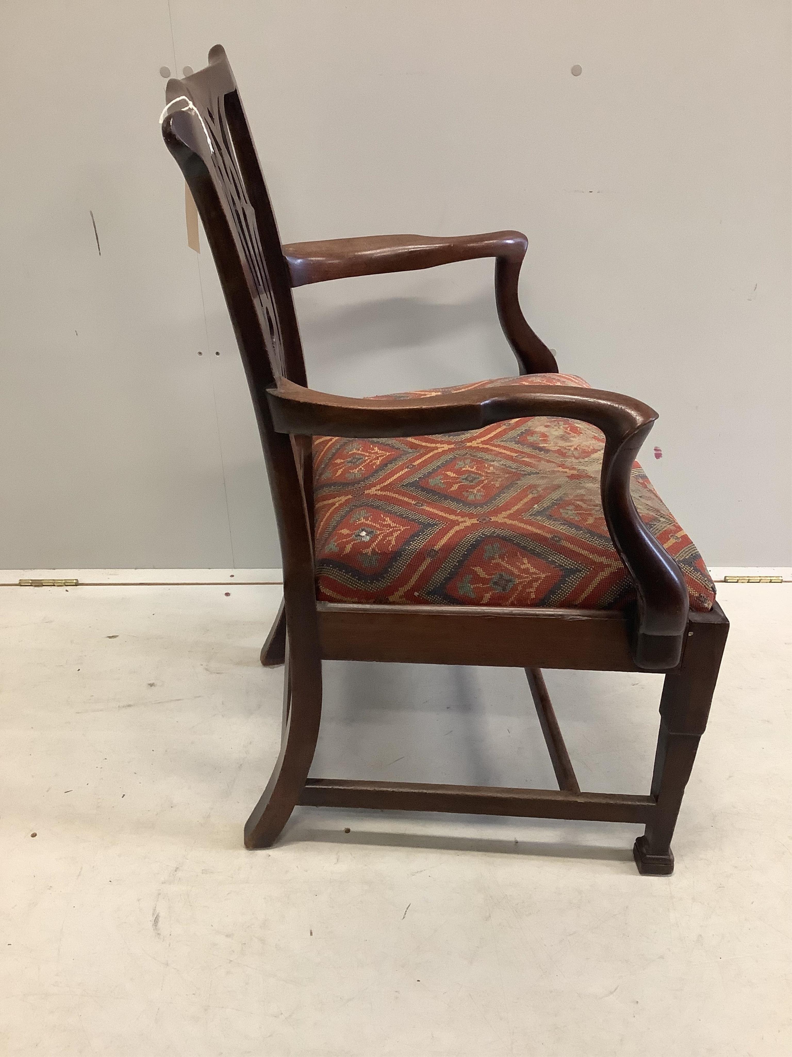 A George III mahogany elbow chair, width 59cm, depth 48cm, height 96cm. Condition - fair